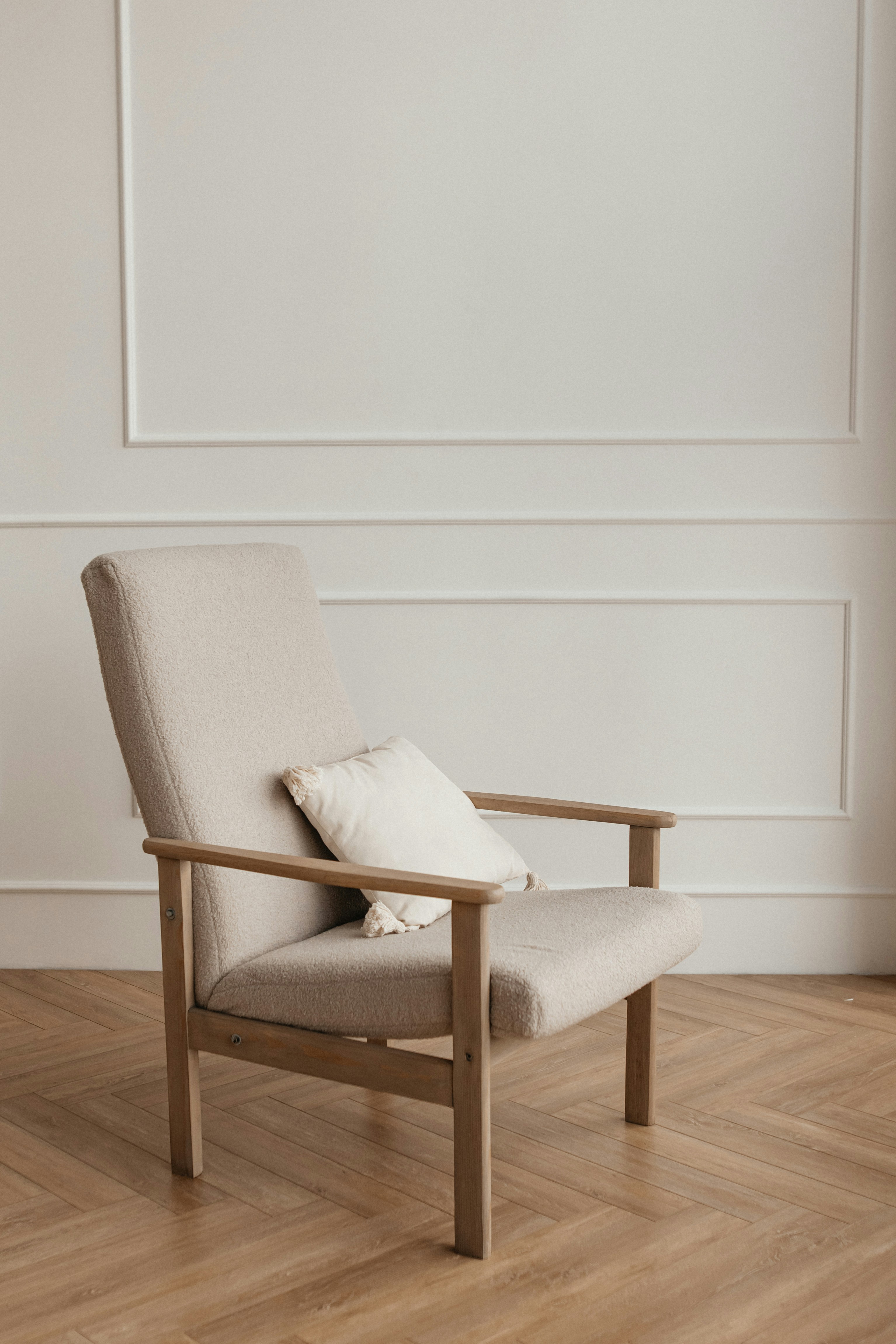 A comfortable chair in a calm, softly lit room